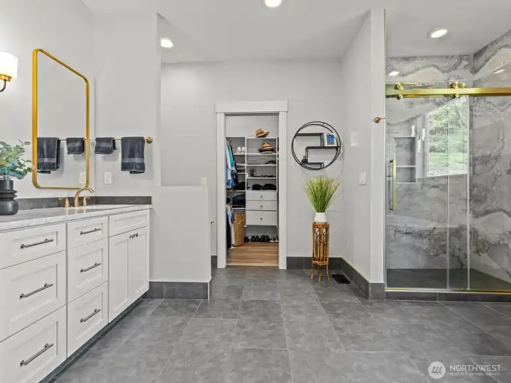 Heated tile floors will grab your feet's attention as you ogle over this primary bathroom. Heated tile floors will grab your feet's attention as you ogle over this primary bathroom.