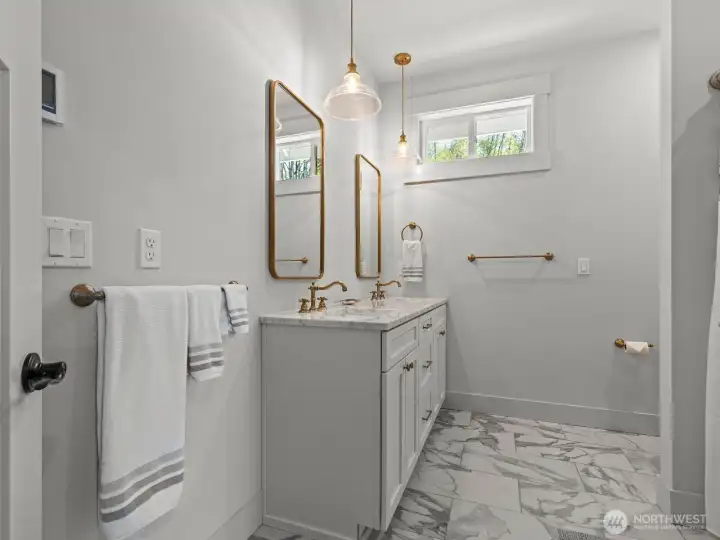 And just like the spa-like primary bathroom, this guest bathroom also has heated floors. And just like the spa-like primary bathroom, this guest bathroom also has heated floors.
