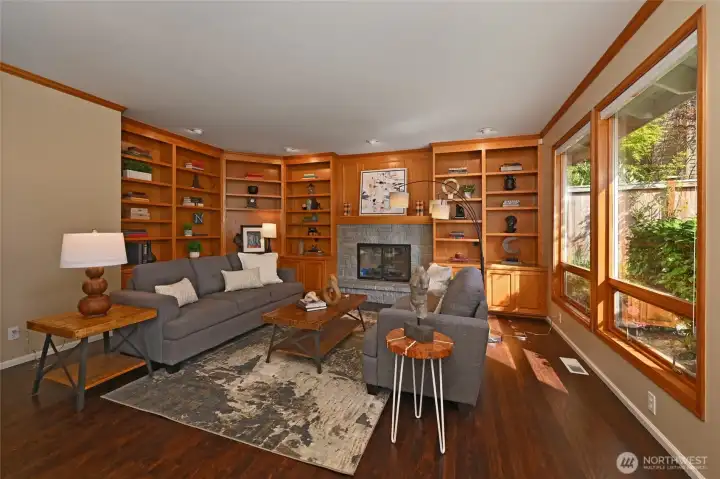 Large family room off the kitchen has fireplace and beautiful built ins.