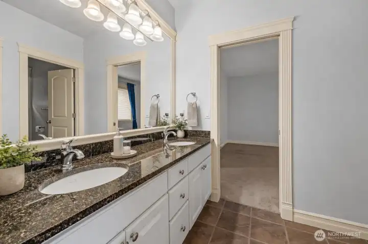 Jack and Jill bath between Bedroom 1 and Bedroom 2 - -Virtually staged to show potential layout and use of space