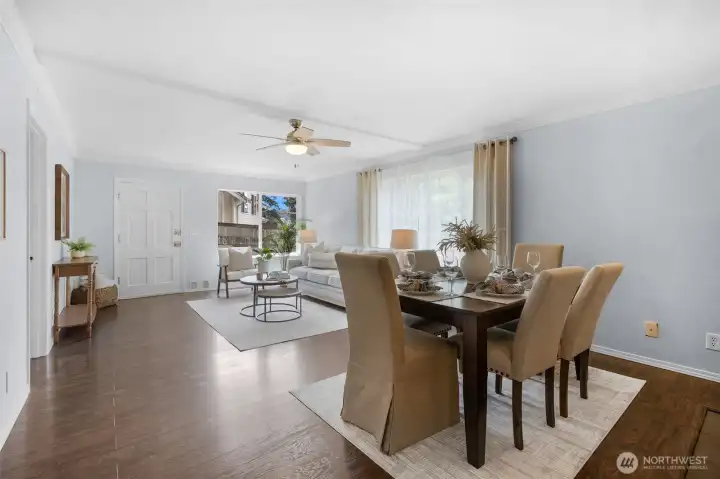 Bright, airy, and incredibly spacious. The grand main living room seamlessly transitions into the formal dining space, creating a versatile, open-concept hub.