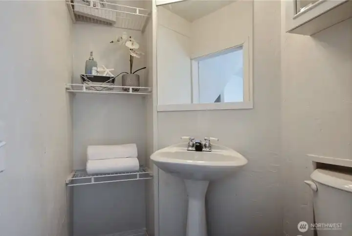The studio/office features a convenient half bath.