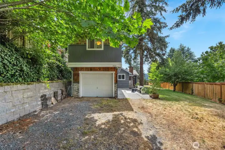 Fantastic storage options! Features a practical half garage perfect for yard tools. All set on a spacious lot with ample parking.