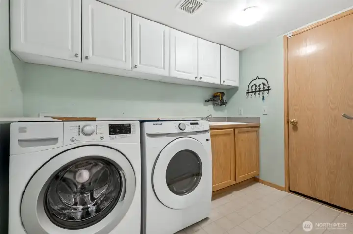 Laundry room, w/d stays and there's a utility sink there too!