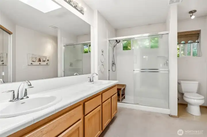 Primary walk in closet. Located in the primary bathroom.