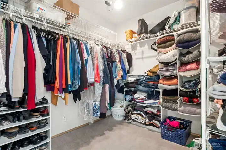 Primary walk in closet. Located in the primary bathroom.