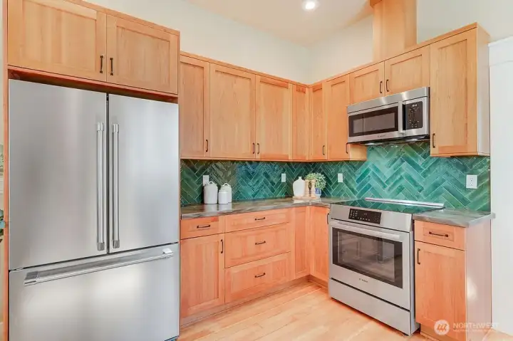 Cabinets are premier Belmont cherry, custom tile and solid surface countertops.
