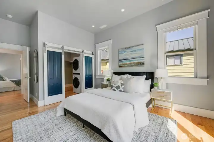 Large primary suite with walk in closet.  Barn doors are restored original fir doors.