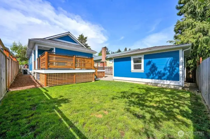 Backyard is fully fenced, new heat pump on the side yard to the left.