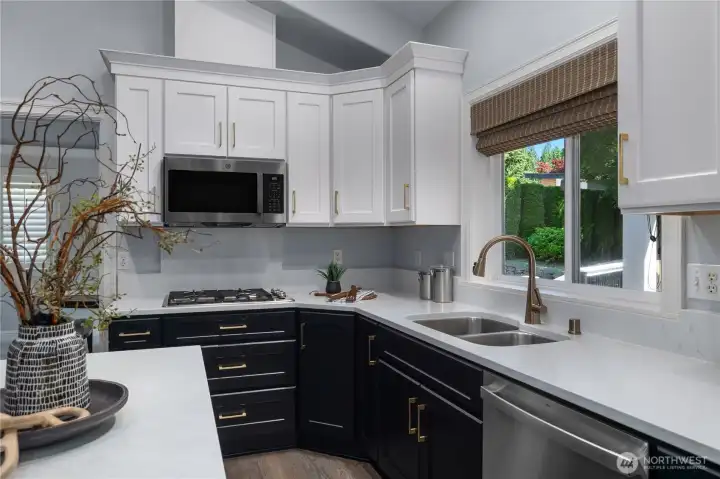 Even doing the dishes is more pleasant when you can look out to the lovely backyard and deck. An efficient working triangle makes kitchen tasks enjoyable. Even doing the dishes is more pleasant when you can look out to the lovely backyard and deck. An efficient working triangle makes kitchen tasks enjoyable.