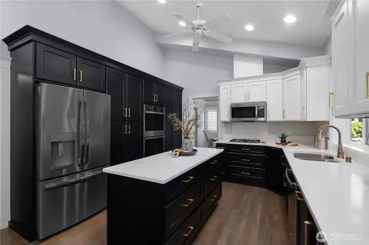 Large island for food prep and buffets, tons of cabinet storage and more countertop workspace make this kitchen stand out. Large island for food prep and buffets, tons of cabinet storage and more countertop workspace make this kitchen stand out.