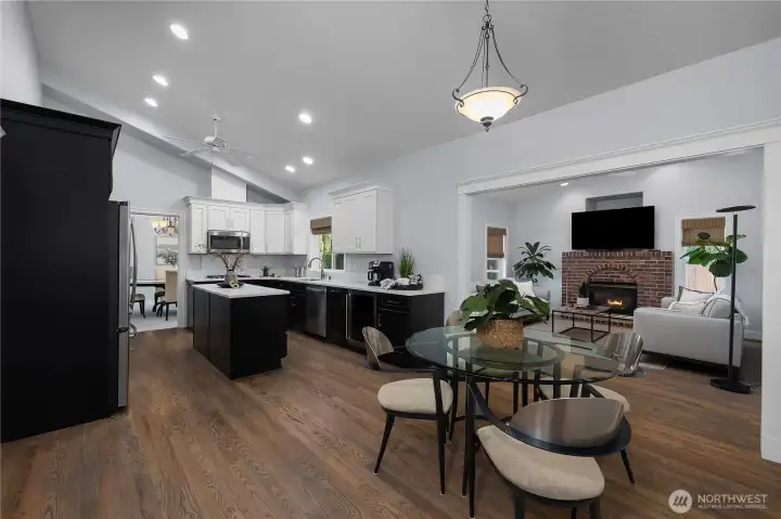 The flow from the kitchen to the informal dining space to the family room makes for easy everyday living and entertaining The flow from the kitchen to the informal dining space to the family room makes for easy everyday living and entertaining