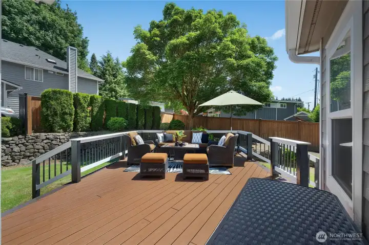 The large, sunny backyard and deck is the perfect place for warm-weather gatherings The large, sunny backyard and deck is the perfect place for warm-weather gatherings