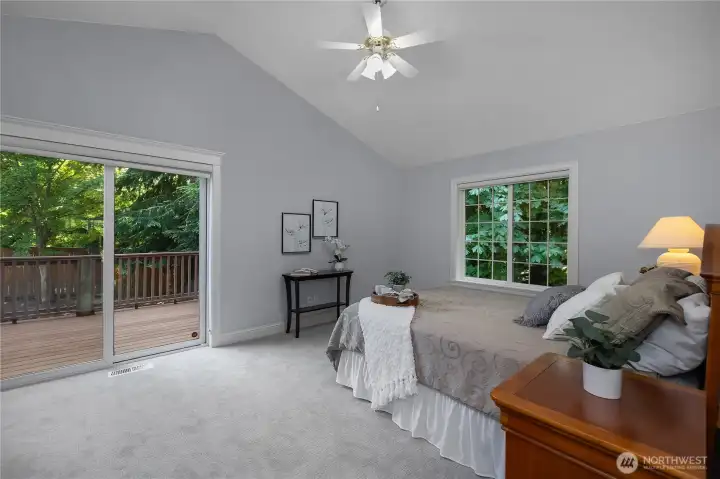 Primary bedroom with private deck access feels like your sleeping in the treetops Primary bedroom with private deck access feels like your sleeping in the treetops