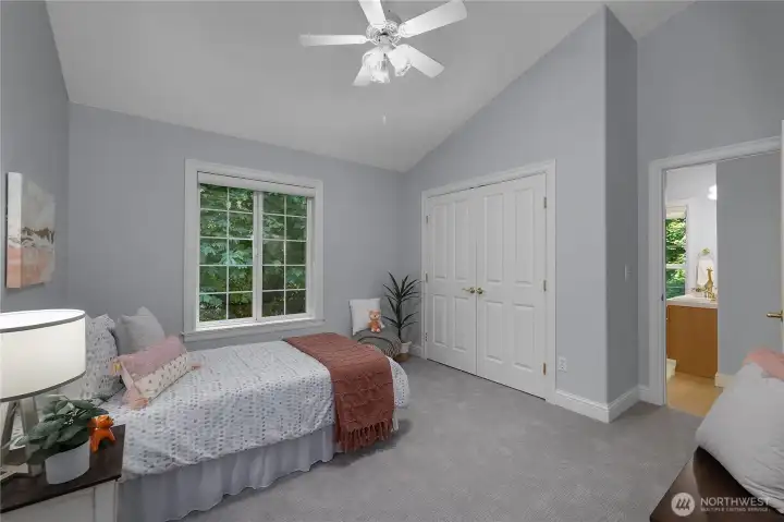 Second bedroom with view of shared walk-through bathroom to the right Second bedroom with view of shared walk-through bathroom to the right