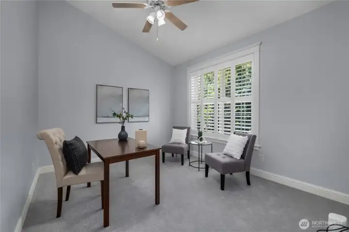 Front office/den with vaulted ceilings, ceiling fan and plantation-style shutters could be used as a home office, den or guest room. Front office/den with vaulted ceilings, ceiling fan and plantation-style shutters could be used as a home office, den or guest room.