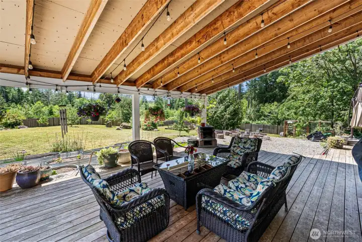 Covered Deck overlooking the beautiful yard.