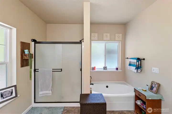 Primary bath with full size shower and soaking tub.