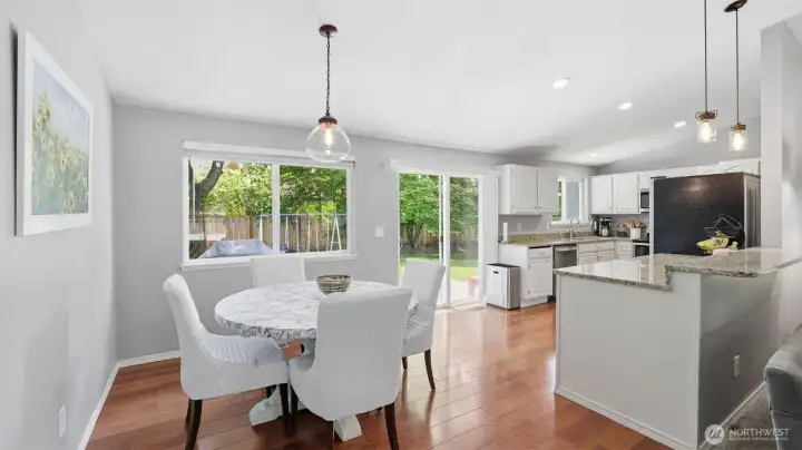 Dining area with access to outdoor patio and kitchen.