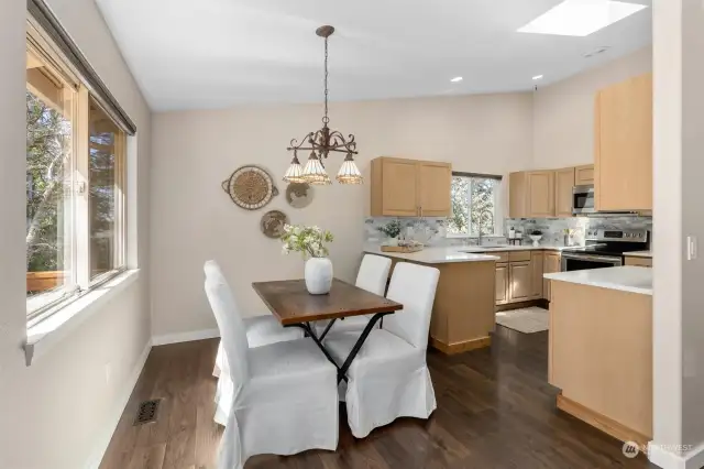 The open dining area + convenient breakfast bar is perfect for hosting guests & everyday meals!
