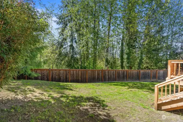 The expansive FULLY FENCED back yard neighbors the Natural Growth Protected Area (NGPA), providing a peaceful & PRIVATE natural landscape!