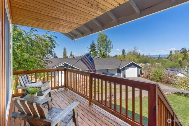 Enjoy the sunrise and mountain views from this charming COVERED PORCH!