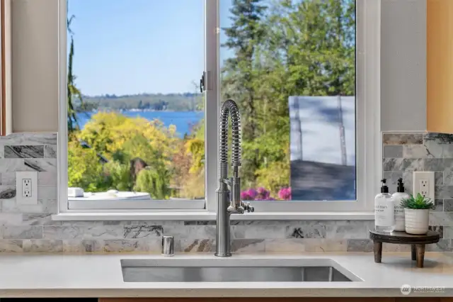 NEW stainless under-mount sink, high-end faucet & garbage disposal! Plus, this beautiful LAKE VIEW makes doing dishes less of a chore!