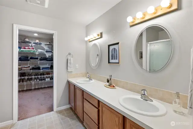 Primary bathroom with extra large dual vanity, plenty of counter space and walk-in shower.