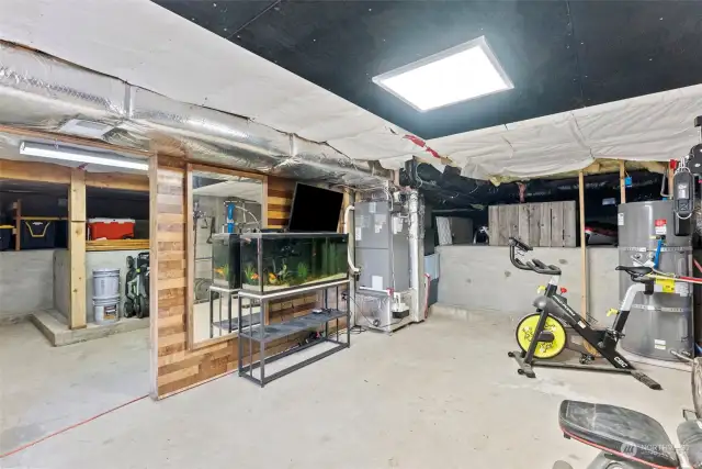Partially finished basement with separate entrance and room for whatever your heart desires.  Use your imagination to complete what has been started.