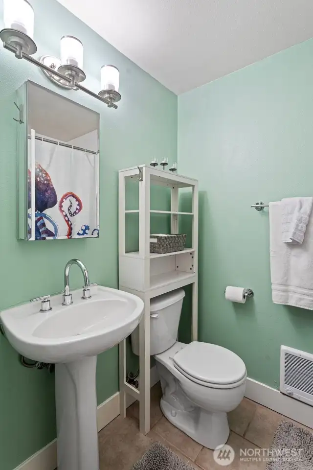 Bathroom has full-sized tub/shower combo