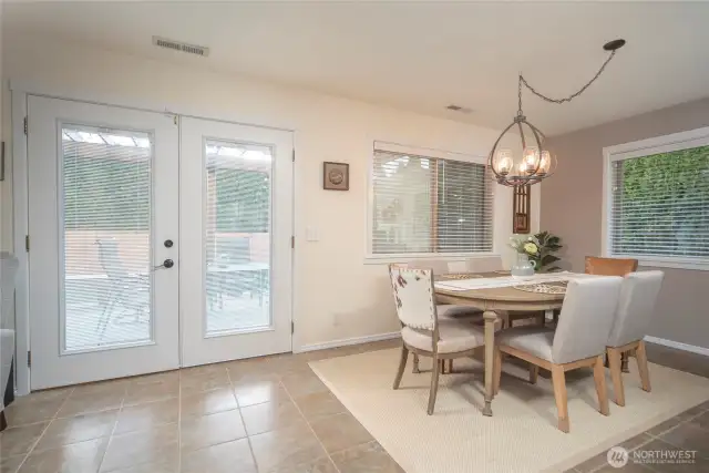 Dining area close to the French doors that lead out to the pergola and deck.