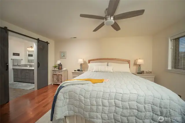 Spacious main bedroom with large ensuite bath, quartz counters and tile and glass walkin shower.