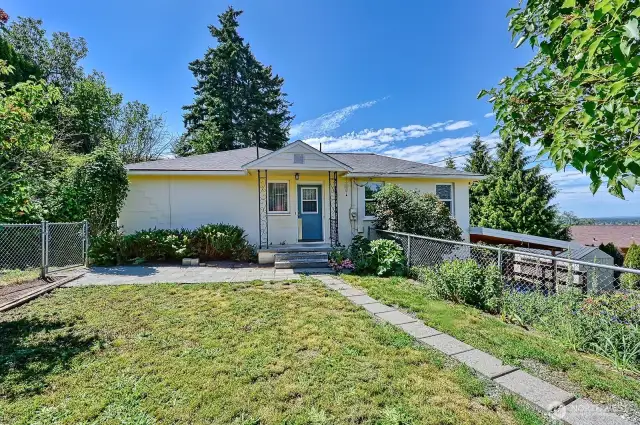 Back of home with patio.