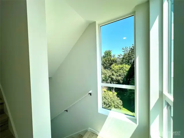 Upper level landing and verdant view.