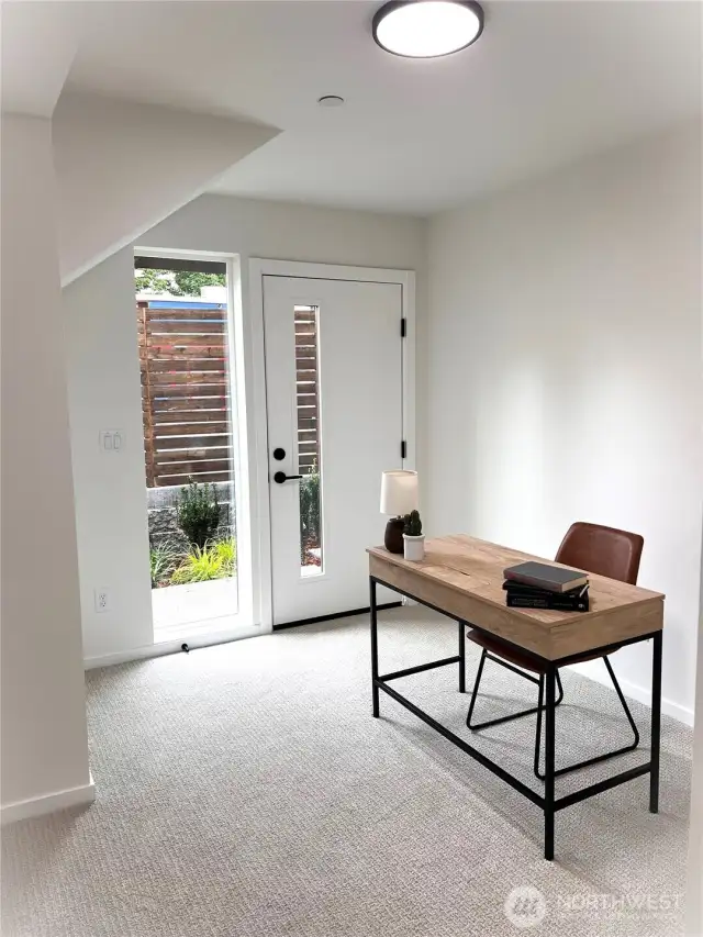 Lower level bed/office with access to your back patio. Model home, colors and finishes may vary.