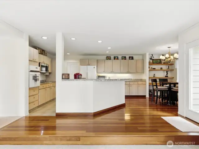 These Brazilian cherry hardwood floor are stunning and add  warmth to the kitchen area and dining area.