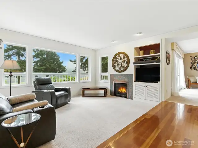 A welcoming living room with plenty of light, views of golf course and large pond. Grandview gas fireplace for those chilly days.