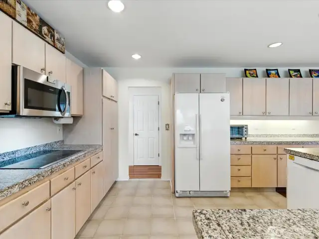 Kitchen provides  an abundance of storage and pantry.