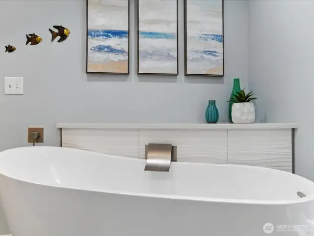 Large bathing tub in this updated primary bathroom. Layback and relax!