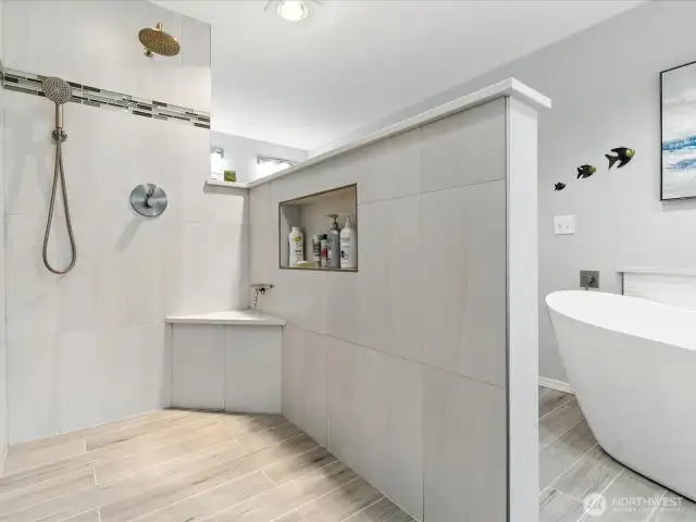 Stepping into an updatged shower with plenty of space is another added feature this home offers.