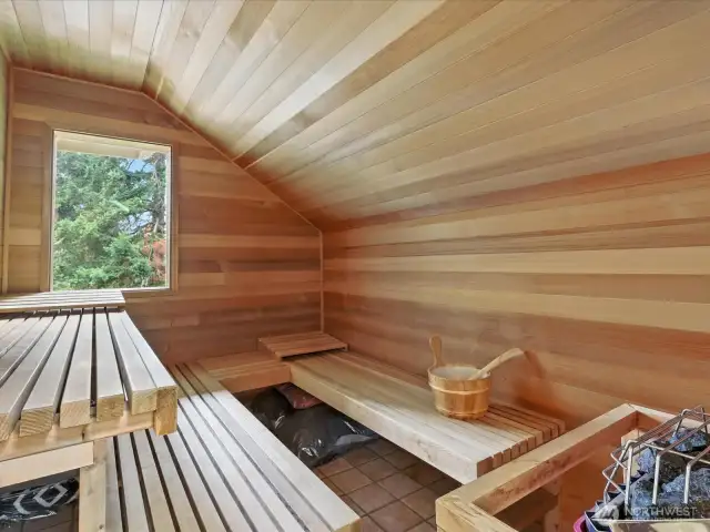This custom installed Finlandia Sauna with etched glass doors and a viewing window to outside is right in your home.