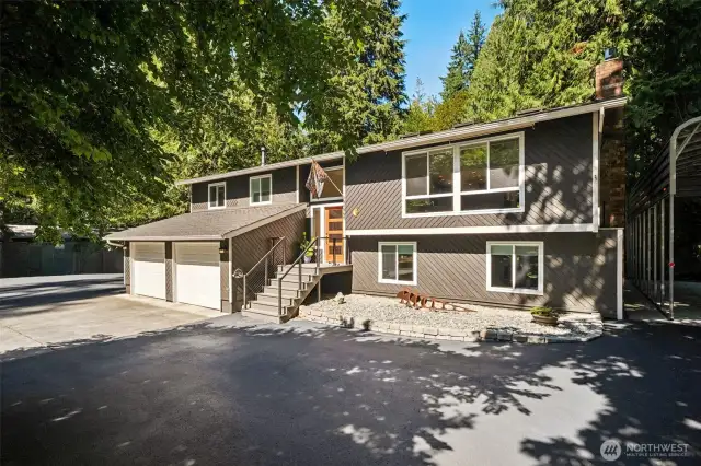 Welcome to your own private oasis in the heart of the highly sought-after Mirrormont neighborhood. New front porch was made more welcoming and a landscaped area created off to the right of the entry. The front door is also brand new and painted a cheery orange! Two brand new garage doors, and new "people" door was added to the side of the garage for easier access to the outside. Driveway was just re-sealed.