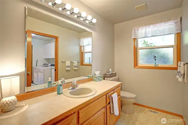 Large half bathroom near utility room.