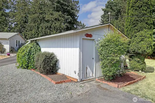 Spacious shed could be converted into DADU. Woodshed on the opposite side.