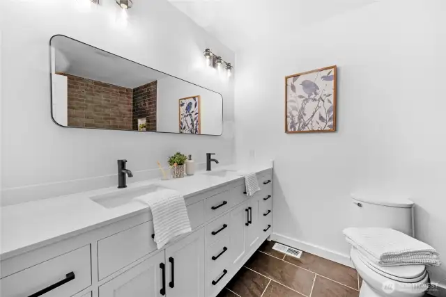 Updated primary bathroom with heated flooring