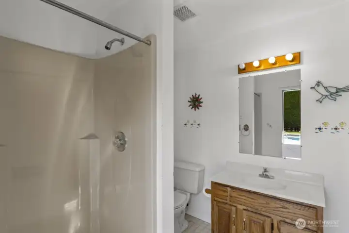 No need to track water inside—the pool house even has its own ¾ bath so guests can shower and freshen up.