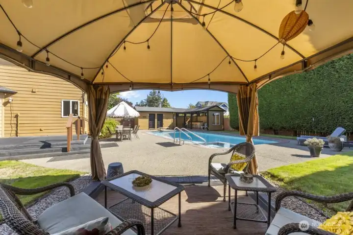 The backyard even includes a gazebo with extra seating—because one hangout spot is never enough.