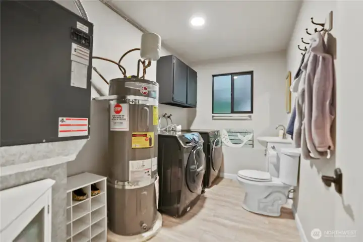 1/2 bath, laundry & utility area between the 'rec' room and 4th bedroom/garage.