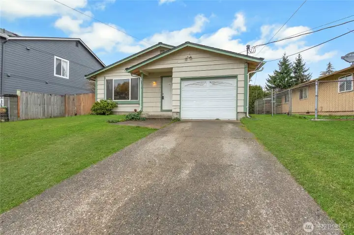 Rambler located on an elevated lot. 3 bd, 1 bath, 1 car.  "Grass is enhanced virtually"