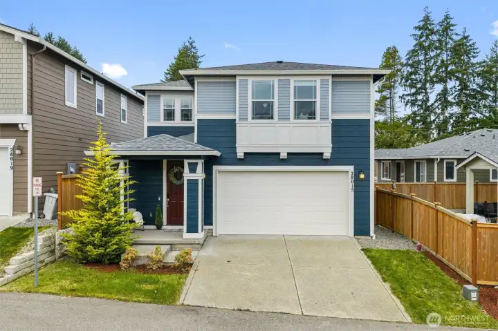 Modern two-story home with clean lines, attached garage, and welcoming curb appeal in a newer Auburn neighborhood.